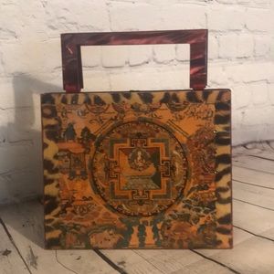 Stella page embossed Sanskrit design handbag